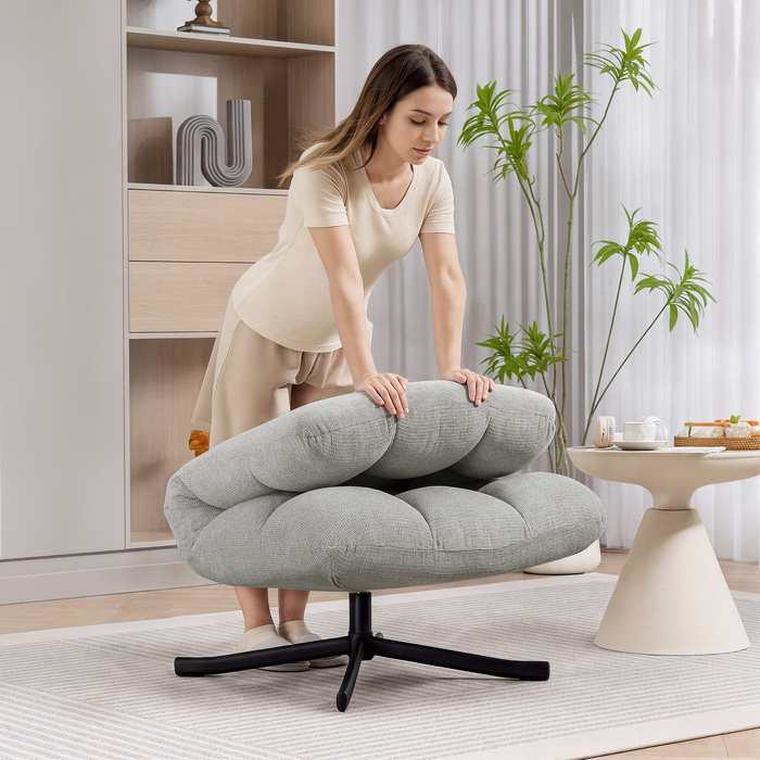 Крісло-релакс з обертовим механізмом та широким сидінням, з водонепроникною тканиною, що імітує вельвет, на перехресних сталевих ніжках, світло-сірого кольору.