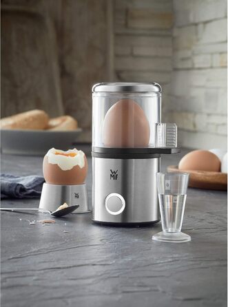 Електричний яйцеварник WMF Stelio, нержавіюча сталь, 1-7 яєць, 380 Вт, регулювання ступенів нагріву, функція підтримання тепла, мірний стакан з викруткою для яєць