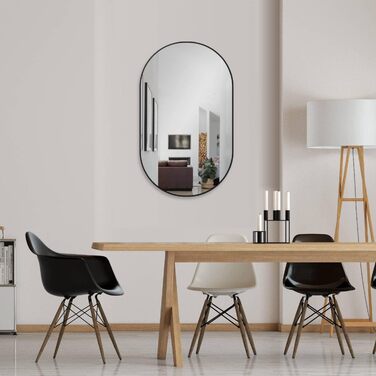 Дзеркало настінне овальне HOKO Design 45x75 см з металевим матовим каркасом. Можлива вертикальна та горизонтальна установка. Підходить для ванної кімнати, коридору, спальні та вітальні.