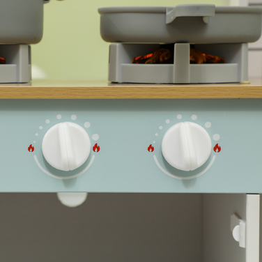 Дитяча кухня з аксесуарами та звуковими ефектами: кавоварка, духовка, багато місця для зберігання. Виготовлена з МДФ та нержавіючої сталі, підходить для дітей від 3 років.