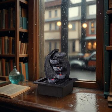 Джерело води Zen'Light Zimmerbrunnen V2 з 4 рівнями, імітація натурального каменю та кольоровим LED-підсвічуванням. Сучасна декор для столу, ідеально для медитації та релаксації. Висота 26 см. Унікальний дизайн.