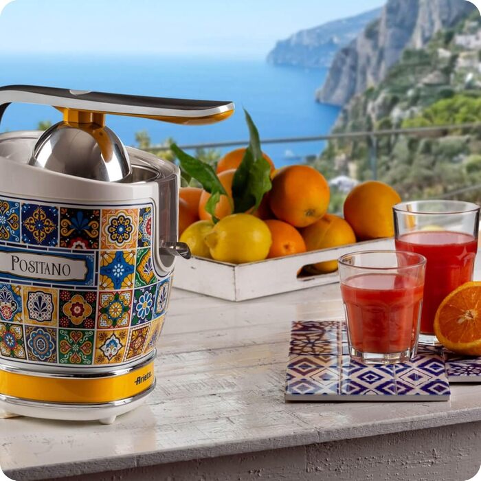 Цитрусовижималка електрична Ariete 413 Positano з металевим корпусом, 2 насадки, захист від крапель, біло-жовта