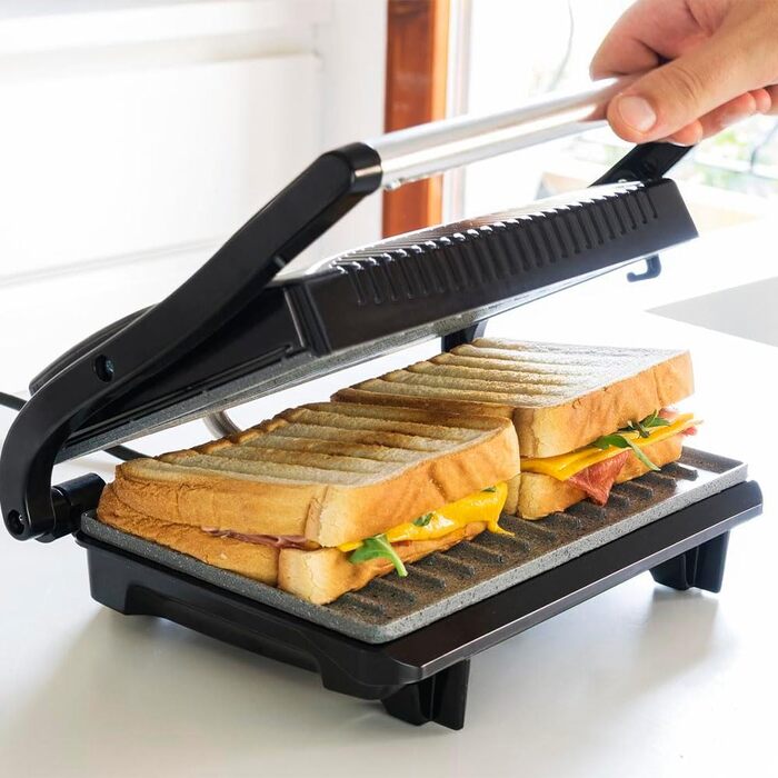 Електрогриль Cecotec Rock'nGrill 700W з антипригарним покриттям, 23x14.5 см, без PTFE та PFOA, плаваюча платформа, холодний ручка, індикатор, вертикальне зберігання